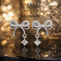 Manshélle - Crystal Bow Elegance Drop Earrings